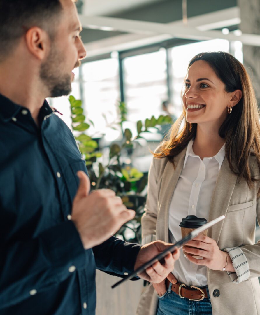 photo of male and female co-worker chatting, link to professional services page